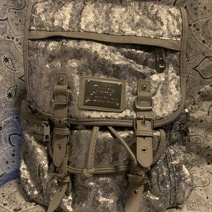 Juicy Couture silver backpack.